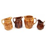 BROWN GLAZE POTTERY PITCHERS - LOT OF 4