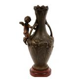 BRONZE VASE WITH CHERUB