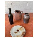 Two Ceramic Jugs, Bottle, and Millstone