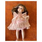 Porcelain Doll with Pink Dress and Markings