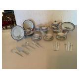 Porcelain Tea Set with Floral Motif and Utensils