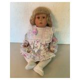 Porcelain Doll with Blonde Hair and Floral Dress