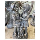 Concrete Sculpture of Children and Dog