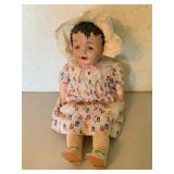 Composition Doll in Printed Outfit and Bonnet