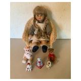 Doll in Chair with Plushes and Figurines