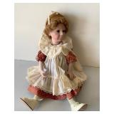 Porcelain Doll in Red Dress with Lace Detail