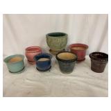 Seven Ceramic Planters with Saucers