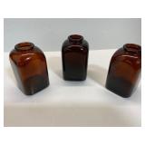 Three Amber Glass Bottles