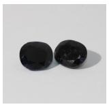 Two oval dark Blue Sapphires that weigh 6.68ctw