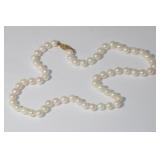 14kt Yellow Gold Pearl Necklace that Features