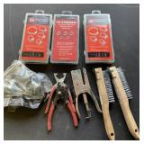 Clamps, wire brushes, and assorted tools