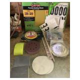 Assorted sandpaper, sanding tools, mailbox number