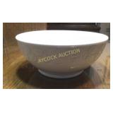 White bowl with leaf pattern on outside