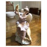 Angel figurine with sea shells