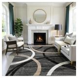 MODERN WAVE CURVE MACHINE WASHABLE AREA RUG IN BLA