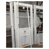 80 X 35 WHITE ALUMINUM STORM DOOR WITH PET DOOR -