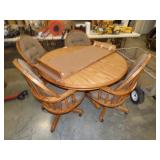 VERY NICE CLEAN AS NEW ROUND OAK TABLE & 4 ROLLING