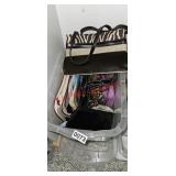 Purses in this tote (master closet)