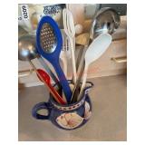 Pitcher full of ladles and strainers (kitchen)