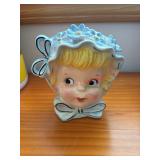 Relpo? flower girl  pocket vase   (behind kitchen