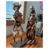 Paper art figures    (behind kitchen bar)