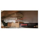 Items on left half of top shelf in closet