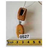 Two small wooden pulleys - train room