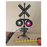 Railroad crossing sign, lights blink - off train