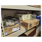 Boxes of jars on this shelf - off train room