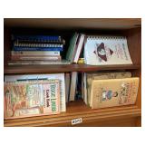 Shelf lot of cook books (dining room)