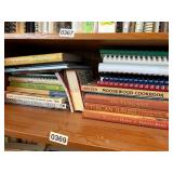 Shelf lot of cook books (dining room)