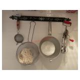 Hanger with items hanging on it  (pantry)