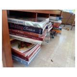 8 cubbies of cook books    (behind kitchen bar)