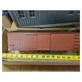 Model boxcar, missing wheels - off train room
