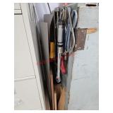 Tools and more beside cabinet- train room