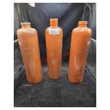 (3) Antique stoneware gin bottles from the