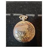 Silver colored pocket watch