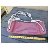 Plastic swing - by playground