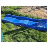 Blue plastic slide - goat pen