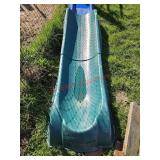 Green plastic slide - goat pen