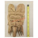Carved wooden mask - mustang garage