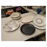 Dishes, pie plates, strainer and a lazy