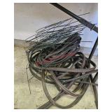 Pair of soaker hoses and flower bed fencing-