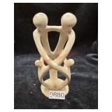 hand-carved soapstone family figure originating