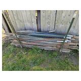 Stack of 6' T posts - next to shed back left