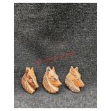 Handcarved, wooden pins of dogs  (Downstairs left)