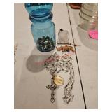 Blue jar with lid and crucifix and figurine with
