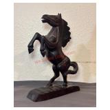 Decorative wooden sculpture of a rearing horse