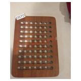 Appears to be a Teak Wood Trivet (Downstairs left