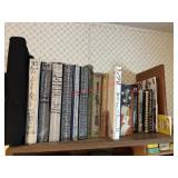 Shelf lot of manuals and books     (Ammo Room)
